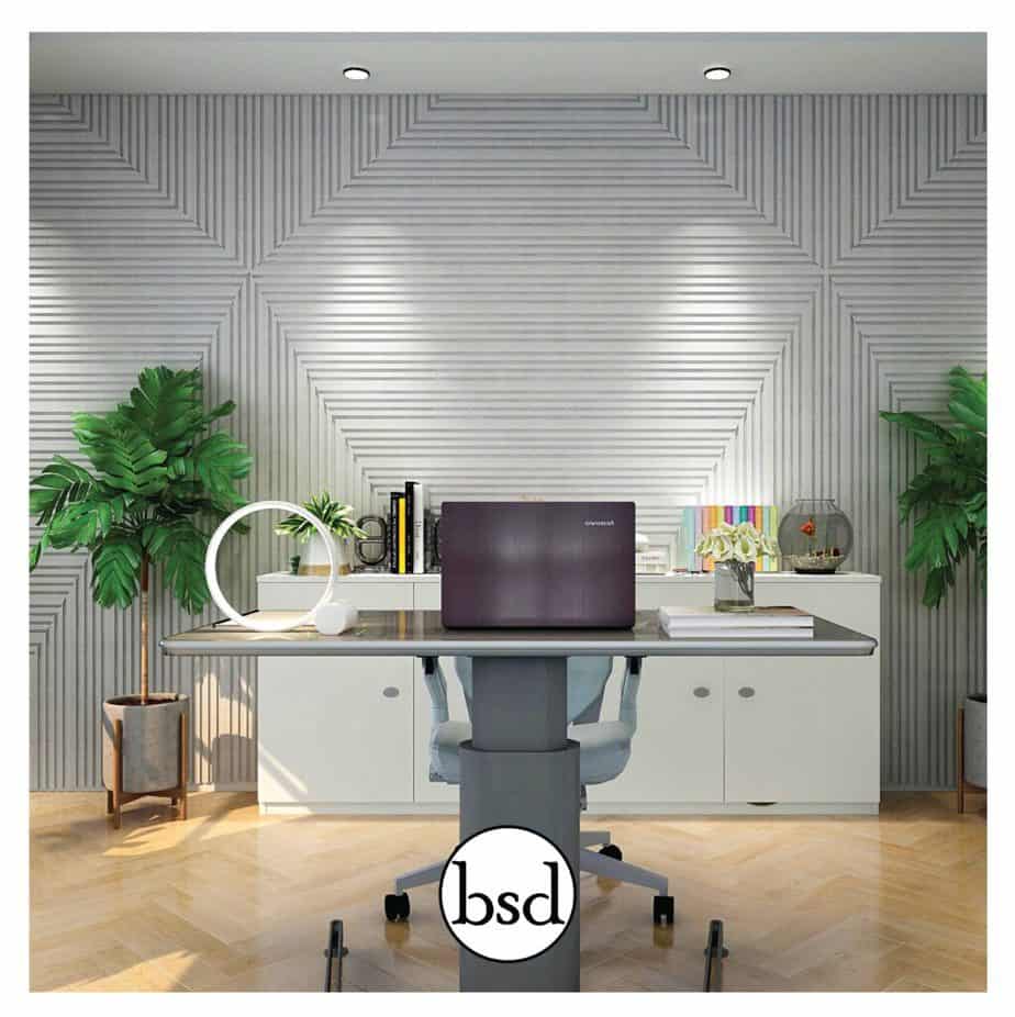 Height adjustable desk with dramatic wood panel wall backdrop.